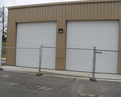 Finish Exterior Metal Wall Panel and Overhead Door at the Jet Truck Garage 